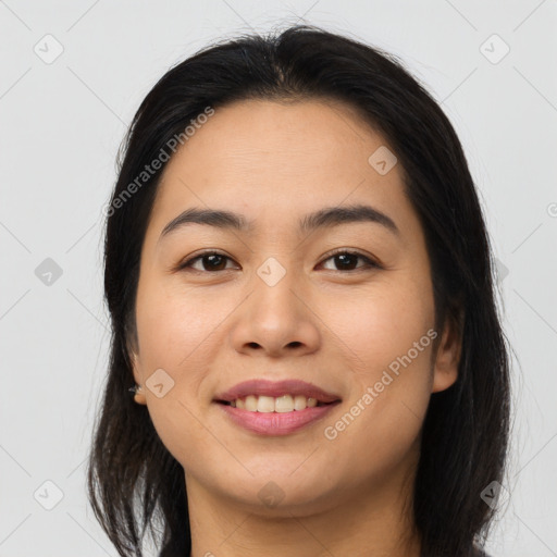 Joyful asian young-adult female with long  brown hair and brown eyes