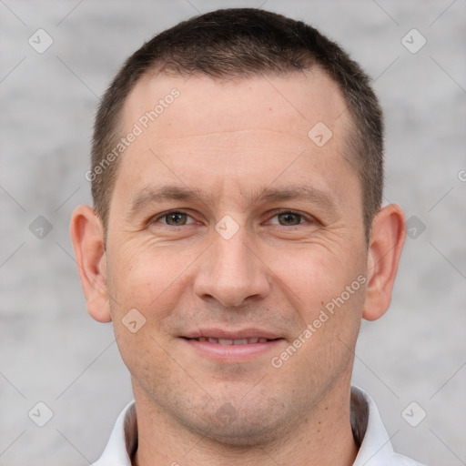 Joyful white adult male with short  brown hair and brown eyes