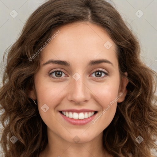 Joyful white young-adult female with long  brown hair and green eyes