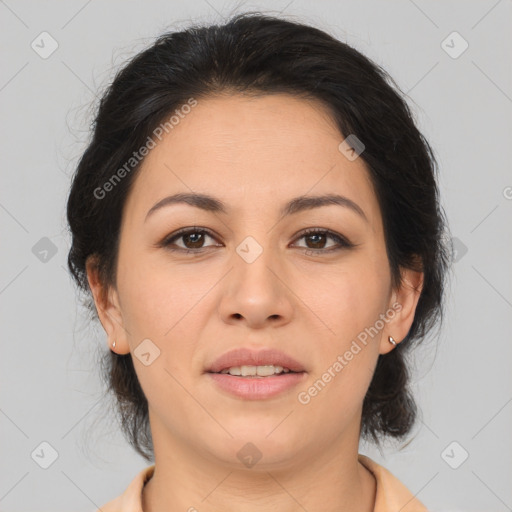 Joyful latino young-adult female with medium  brown hair and brown eyes