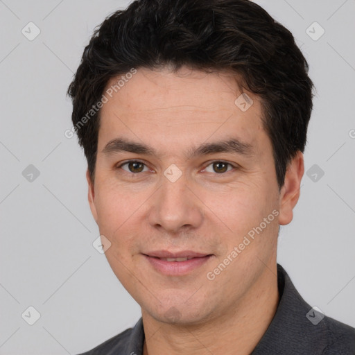 Joyful white young-adult male with short  black hair and brown eyes