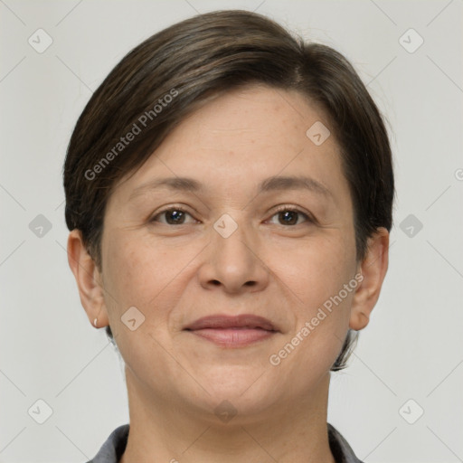 Joyful white adult female with short  brown hair and grey eyes