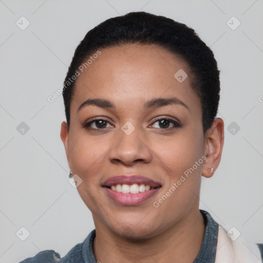 Joyful latino young-adult female with short  black hair and brown eyes