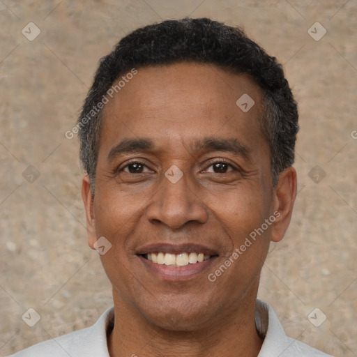 Joyful latino adult male with short  black hair and brown eyes