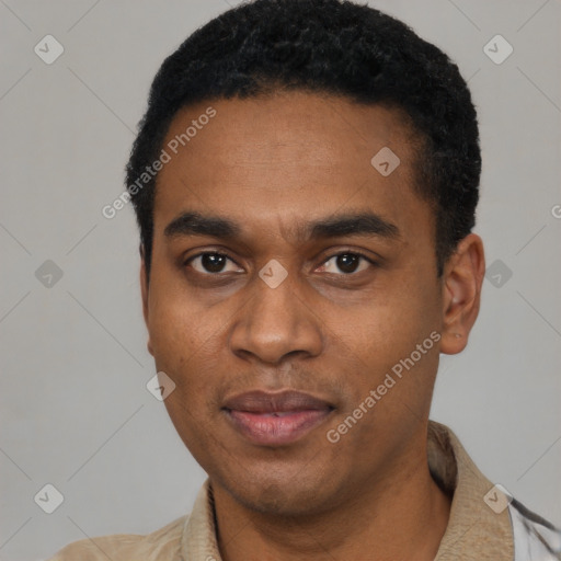 Joyful black young-adult male with short  black hair and brown eyes