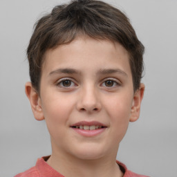 Joyful white child male with short  brown hair and brown eyes