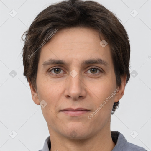 Joyful white adult male with short  brown hair and grey eyes