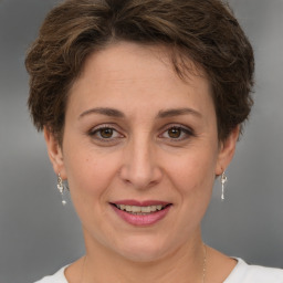 Joyful white adult female with short  brown hair and brown eyes