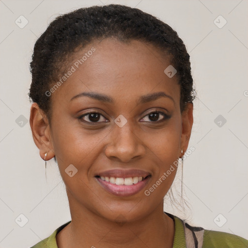 Joyful black young-adult female with short  brown hair and brown eyes