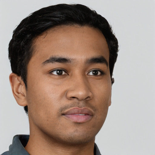 Neutral latino young-adult male with short  brown hair and brown eyes