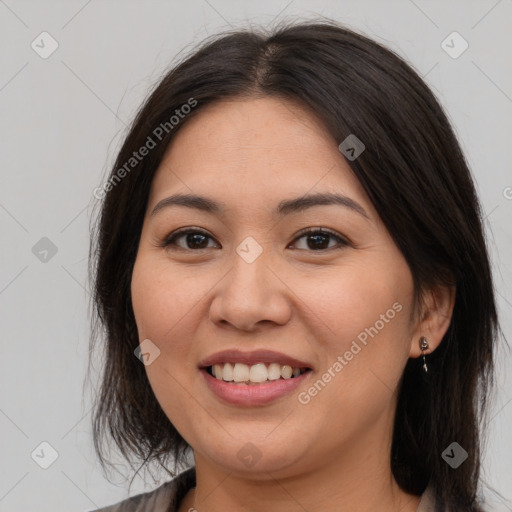 Joyful asian young-adult female with medium  brown hair and brown eyes