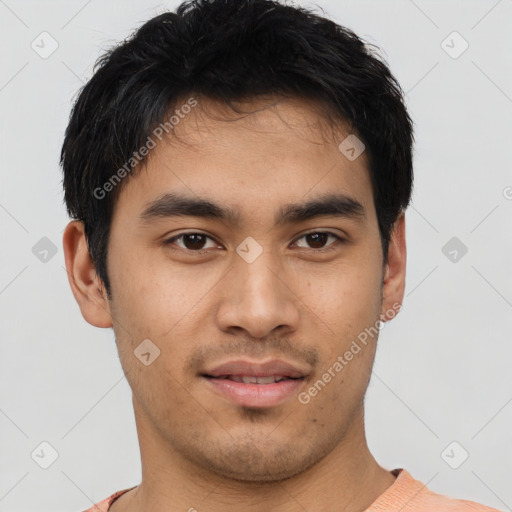 Joyful asian young-adult male with short  brown hair and brown eyes