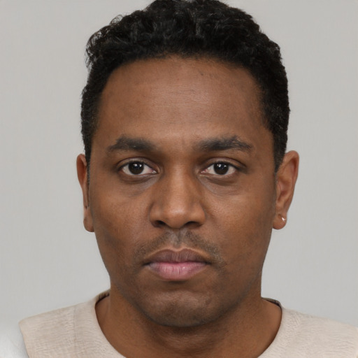 Neutral black young-adult male with short  black hair and brown eyes