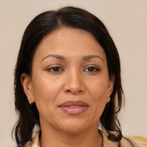 Joyful white adult female with medium  brown hair and brown eyes