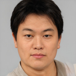 Neutral asian young-adult male with short  brown hair and brown eyes