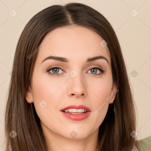 Joyful white young-adult female with long  brown hair and green eyes