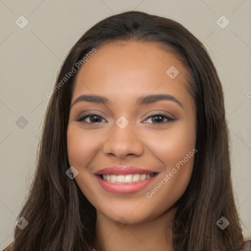 Joyful latino young-adult female with long  brown hair and brown eyes