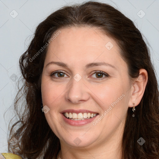 Joyful white adult female with long  brown hair and brown eyes