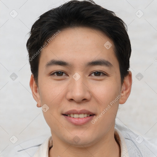 Joyful asian young-adult male with short  brown hair and brown eyes
