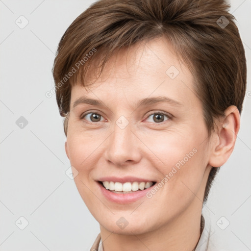 Joyful white young-adult female with short  brown hair and grey eyes