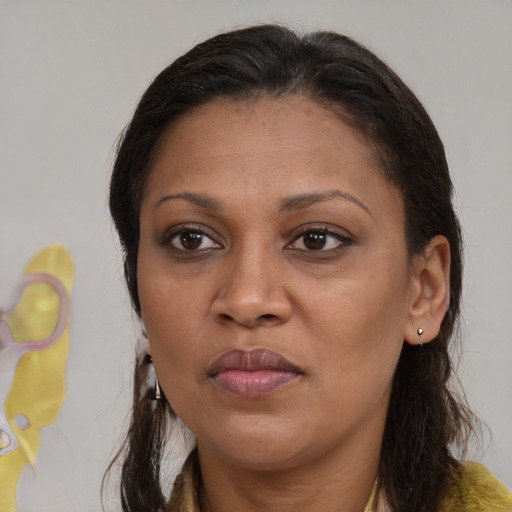 Joyful white adult female with medium  brown hair and brown eyes