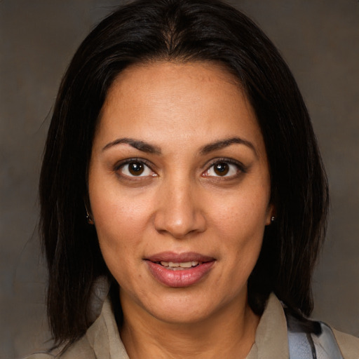 Joyful white adult female with medium  brown hair and brown eyes