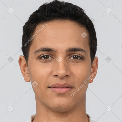 Joyful latino young-adult male with short  brown hair and brown eyes