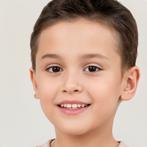 Joyful white child female with short  brown hair and brown eyes