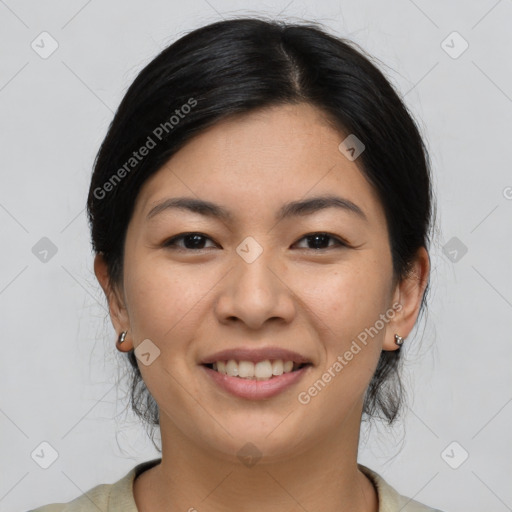 Joyful asian young-adult female with medium  black hair and brown eyes