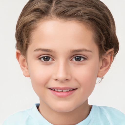 Joyful white child female with short  brown hair and brown eyes