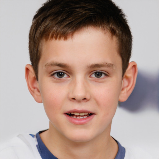 Joyful white child male with short  brown hair and brown eyes