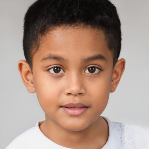 Joyful white child male with short  brown hair and brown eyes