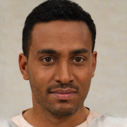 Neutral latino young-adult male with short  brown hair and brown eyes