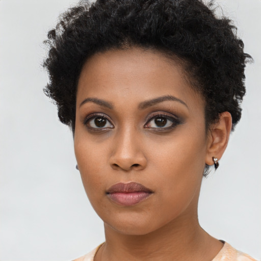 Neutral black young-adult female with short  brown hair and brown eyes