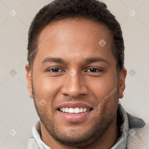 Joyful black young-adult male with short  brown hair and brown eyes