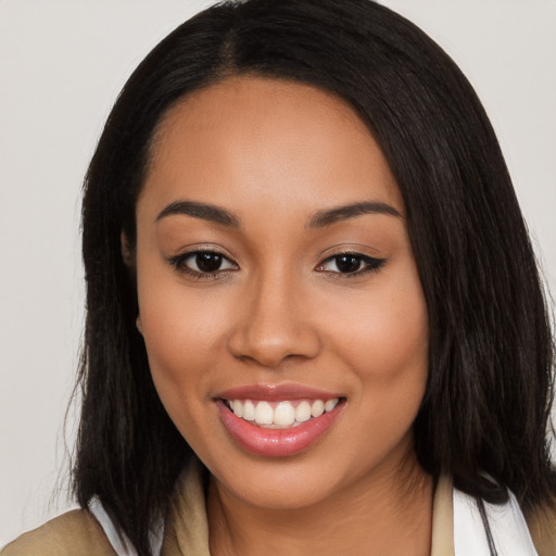 Joyful latino young-adult female with long  black hair and brown eyes