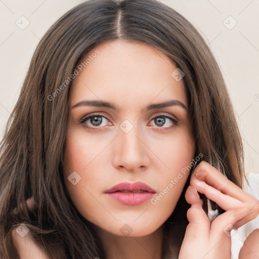 Neutral white young-adult female with long  brown hair and brown eyes