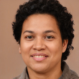 Joyful latino adult female with medium  brown hair and brown eyes