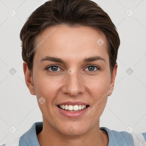 Joyful white young-adult female with short  brown hair and grey eyes