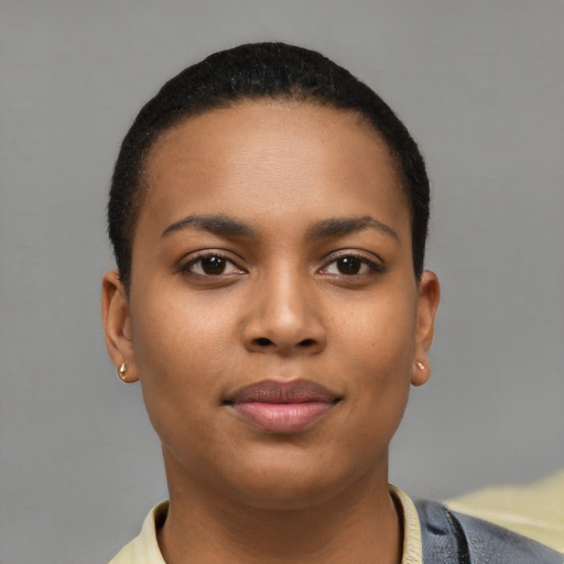 Joyful latino young-adult female with short  black hair and brown eyes