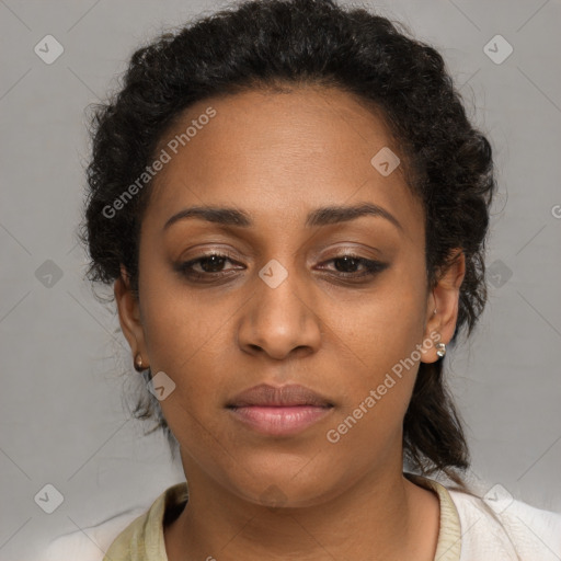 Joyful black adult female with medium  brown hair and brown eyes