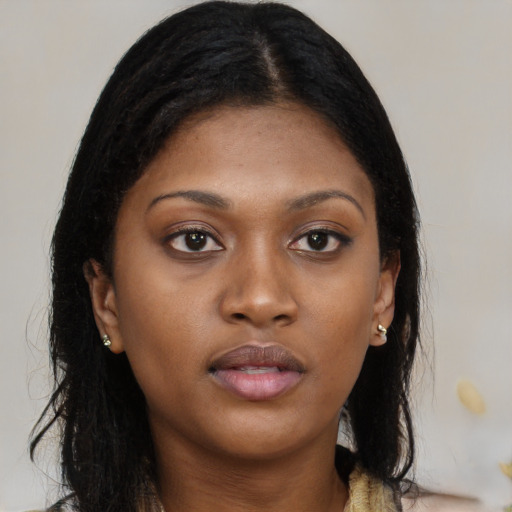 Neutral black young-adult female with long  brown hair and brown eyes