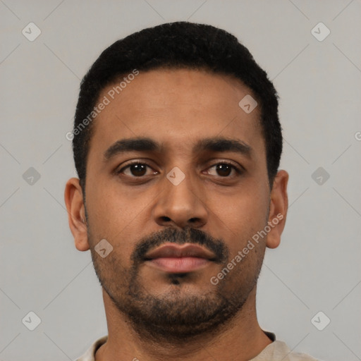 Neutral latino young-adult male with short  black hair and brown eyes