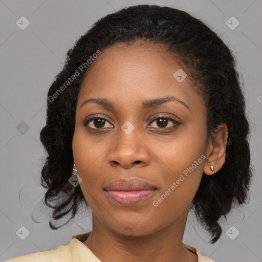 Joyful black young-adult female with long  brown hair and brown eyes