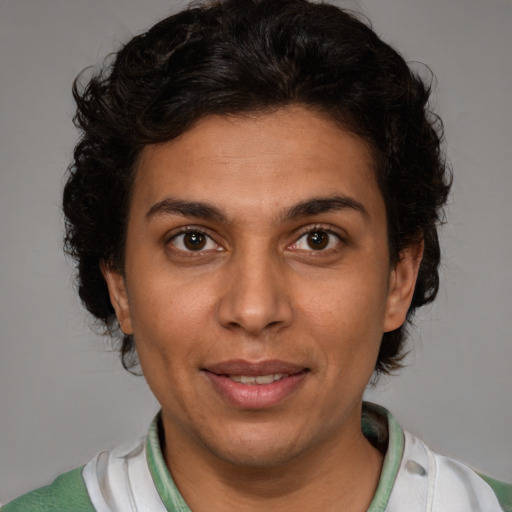 Joyful latino young-adult female with short  brown hair and brown eyes