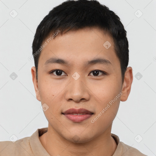 Joyful asian young-adult male with short  black hair and brown eyes