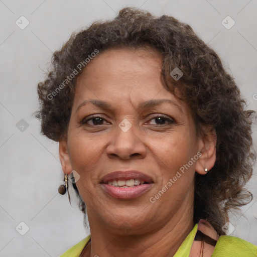 Joyful black adult female with short  brown hair and brown eyes