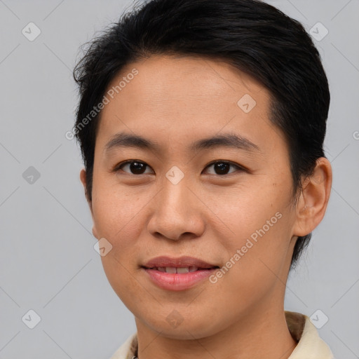 Joyful asian young-adult male with short  brown hair and brown eyes