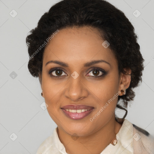 Joyful black young-adult female with medium  brown hair and brown eyes