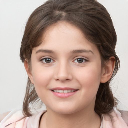 Joyful white child female with medium  brown hair and grey eyes